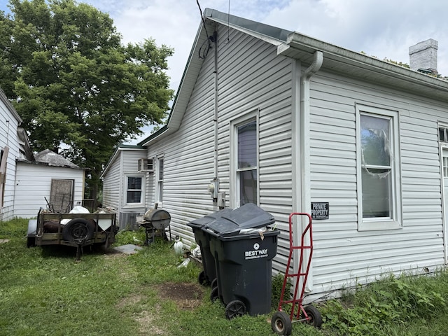 3057 Front St, Petersburg, KY 41080 - view of home's exterior featuring a chimney and cooling unit