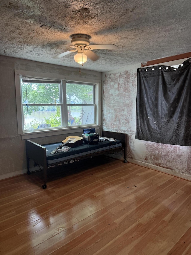 3057 Front St, Petersburg, KY 41080 - unfurnished room featuring healthy amount of natural light, hardwood / wood-style floors, and a ceiling fan
