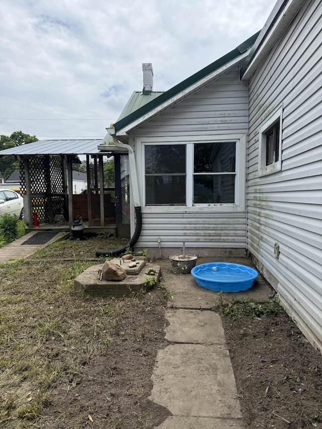 3057 Front St, Petersburg, KY 41080 - view of property exterior with a chimney and a metal roof