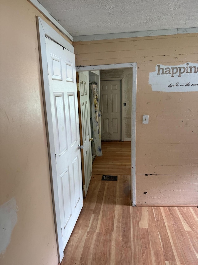 3057 Front St, Petersburg, KY 41080 - corridor featuring wood finished floors and a textured ceiling