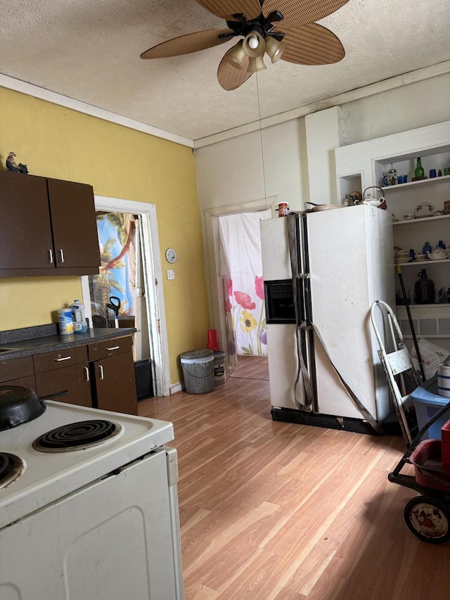 3057 Front St, Petersburg, KY 41080 - kitchen featuring white appliances, ceiling fan, light wood finished floors, dark countertops, and a textured ceiling