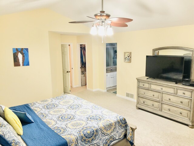 9128 Belvedere Ct, Florence, KY 41042 - bedroom with light colored carpet, vaulted ceiling, ceiling fan, and ensuite bath