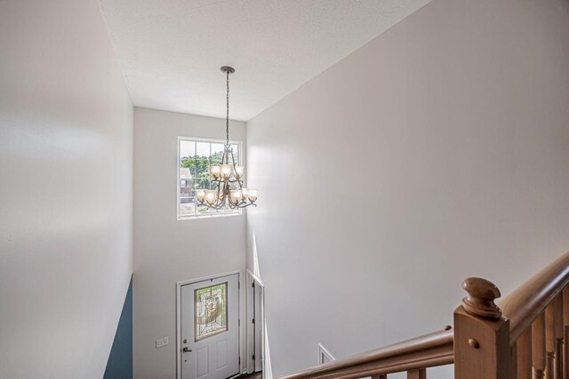 9128 Belvedere Ct, Florence, KY 41042 - foyer entrance with a chandelier
