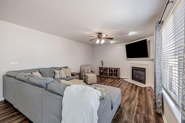 9128 Belvedere Ct, Florence, KY 41042 - living area with dark wood-style floors, ceiling fan, and a tiled fireplace