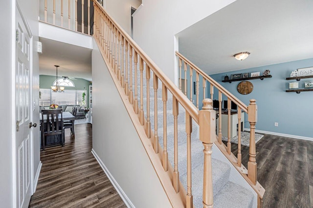 9128 Belvedere Ct, Florence, KY 41042 - staircase featuring wood finished floors and a chandelier