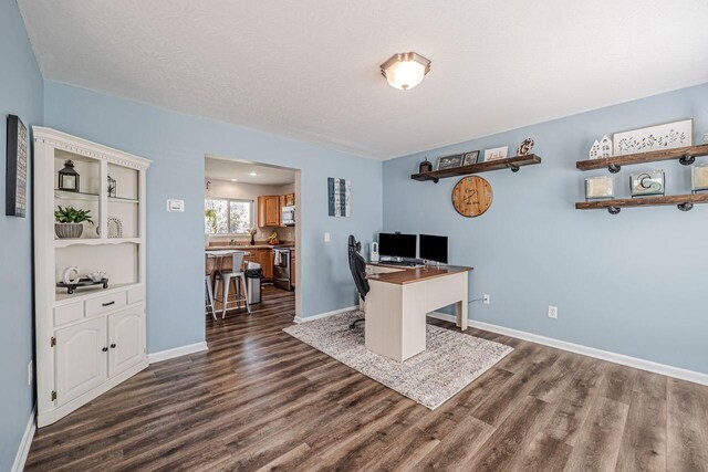 9128 Belvedere Ct, Florence, KY 41042 - office featuring dark wood-style floors and baseboards