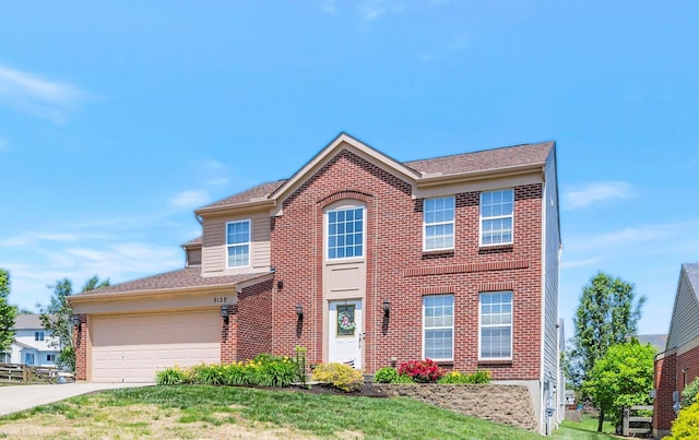 9128 Belvedere Ct, Florence, KY 41042 - view of front of property with brick siding, driveway, an attached garage, and a front lawn