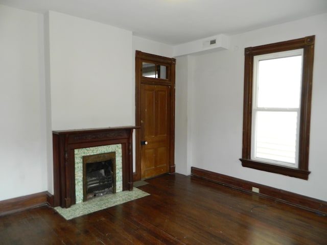 837 Central Ave, Newport, KY 41071 - unfurnished living room with dark wood-style flooring and a fireplace with flush hearth