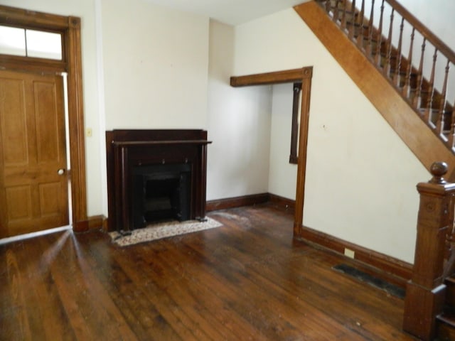 837 Central Ave, Newport, KY 41071 - unfurnished living room featuring wood finished floors, stairs, and a fireplace with flush hearth