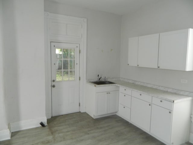 837 Central Ave, Newport, KY 41071 - kitchen featuring white cabinets, light wood-style floors, and light countertops