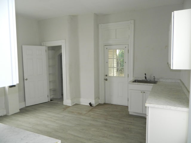 837 Central Ave, Newport, KY 41071 - kitchen with white cabinets, light countertops, and light wood-type flooring