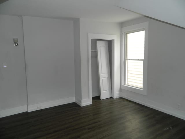 837 Central Ave, Newport, KY 41071 - additional living space with dark wood-type flooring and baseboards