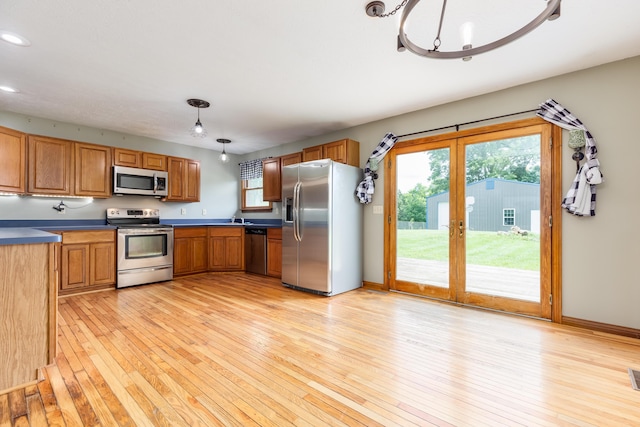 1041 Kidwell Rd, Demossville, KY 41033 - kitchen with stainless steel appliances, french doors, light wood-style floors, recessed lighting, and dark countertops