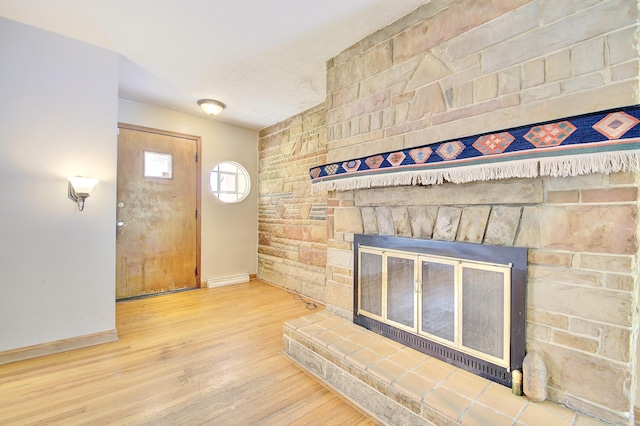 5370 Skyline Dr, Highland Heights, KY 41076 - foyer with a stone fireplace and wood finished floors