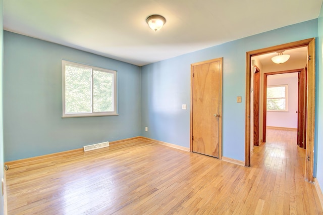5370 Skyline Dr, Highland Heights, KY 41076 - unfurnished bedroom featuring light wood finished floors and multiple windows