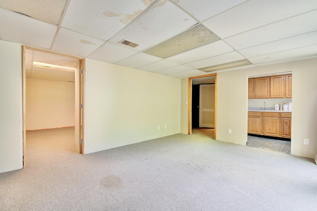 5370 Skyline Dr, Highland Heights, KY 41076 - unfurnished living room featuring a drop ceiling and light colored carpet