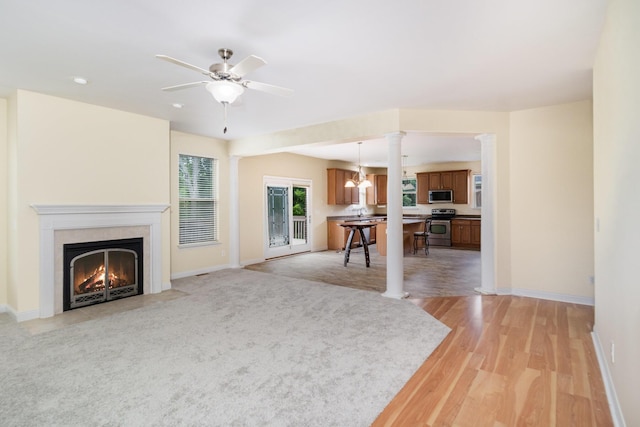 1464 Shirepeak Way, Independence, KY 41051 - living room with light wood-style floors, a high end fireplace, ceiling fan, recessed lighting, and decorative columns