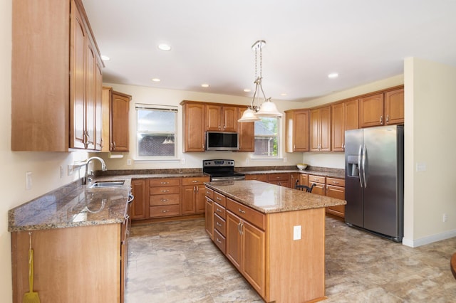 1464 Shirepeak Way, Independence, KY 41051 - kitchen featuring appliances with stainless steel finishes, a center island, dark stone countertops, pendant lighting, and recessed lighting