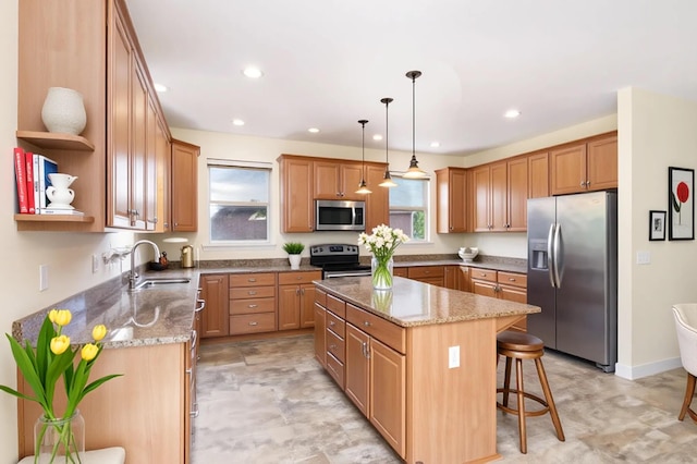 1464 Shirepeak Way, Independence, KY 41051 - kitchen with appliances with stainless steel finishes, a center island, a breakfast bar, light stone countertops, and open shelves