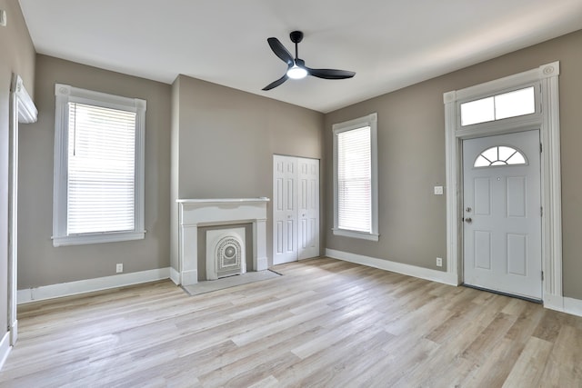 1508 Holman Ave, Covington, KY 41011 - unfurnished living room featuring light wood-style flooring and ceiling fan