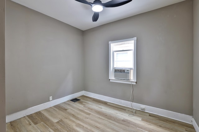 1508 Holman Ave, Covington, KY 41011 - empty room with cooling unit, light wood-style flooring, and a ceiling fan