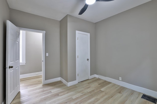 1508 Holman Ave, Covington, KY 41011 - unfurnished bedroom featuring light wood-style flooring and a ceiling fan