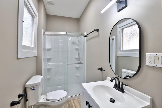 1508 Holman Ave, Covington, KY 41011 - bathroom with a shower stall, healthy amount of natural light, vanity, and wood finished floors