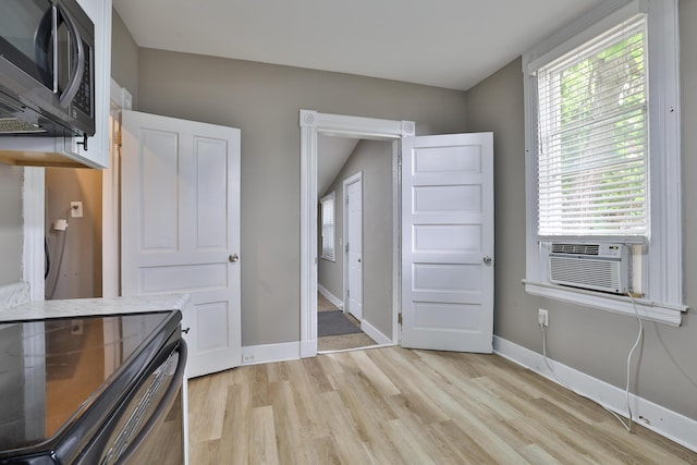 1508 Holman Ave, Covington, KY 41011 - unfurnished bedroom with light wood-type flooring and cooling unit