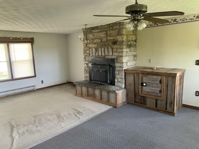 165 Davis Lake Rd, Owenton, KY 40359 - unfurnished living room with carpet floors, ceiling fan, baseboard heating, and a stone fireplace