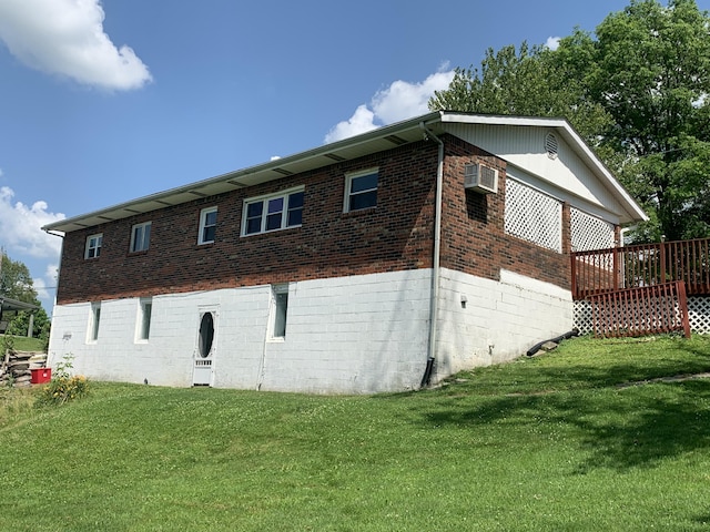 165 Davis Lake Rd, Owenton, KY 40359 - view of property exterior featuring brick siding, a lawn, a wooden deck, and a wall mounted air conditioner