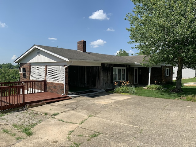 165 Davis Lake Rd, Owenton, KY 40359 - rear view of property featuring brick siding, a wooden deck, a chimney, and a patio area