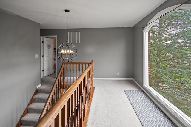 25 Regiment Ct, Wilder, KY 41076 - hall with carpet, a chandelier, and healthy amount of natural light