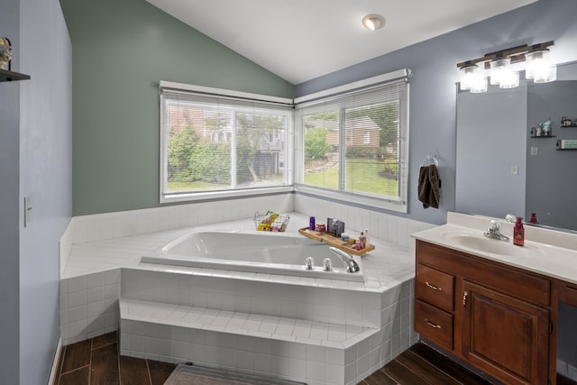 25 Regiment Ct, Wilder, KY 41076 - bathroom with vanity, a bath, lofted ceiling, wood finished floors, and plenty of natural light