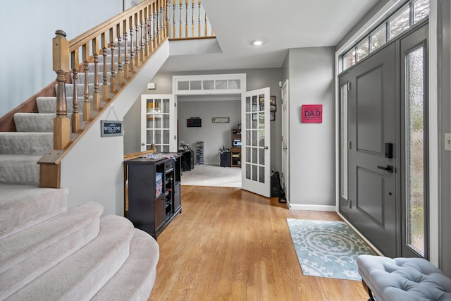 25 Regiment Ct, Wilder, KY 41076 - entrance foyer with french doors, stairway, wood finished floors, and recessed lighting