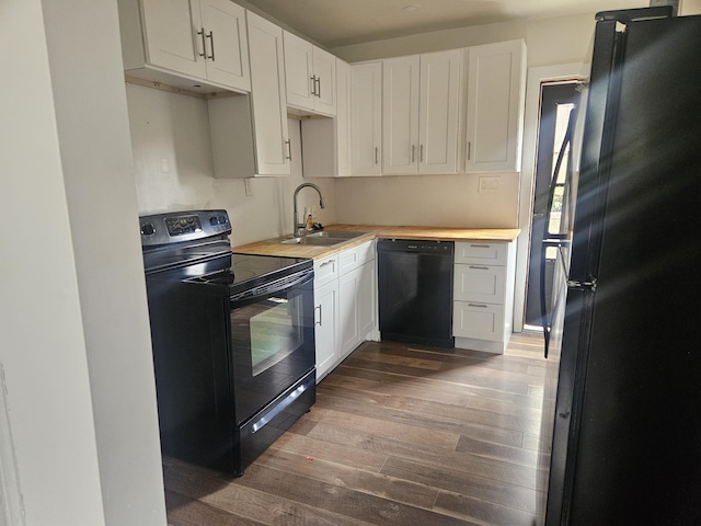 330 Silver St, Dayton, KY 41074 - kitchen with black appliances, dark wood-style floors, and white cabinets