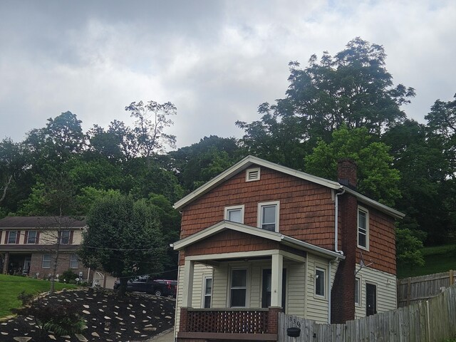 330 Silver St, Dayton, KY 41074 - view of front of house featuring a chimney and a porch