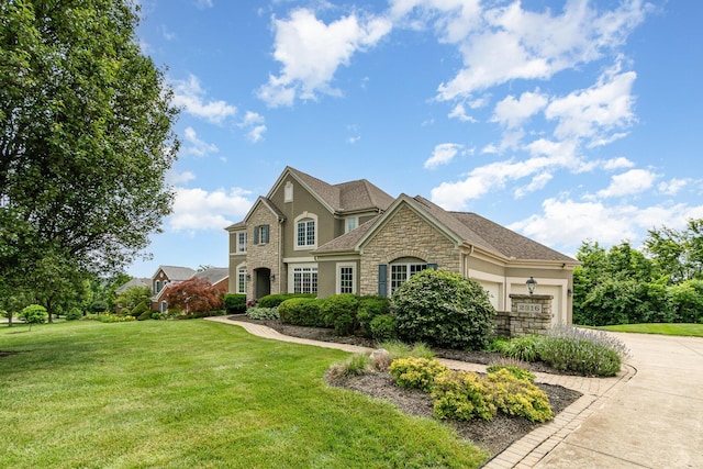 2316 Pinnacle Ct, Hebron, KY 41048 - view of front of property featuring stone siding, stucco siding, a garage, a front lawn, and driveway