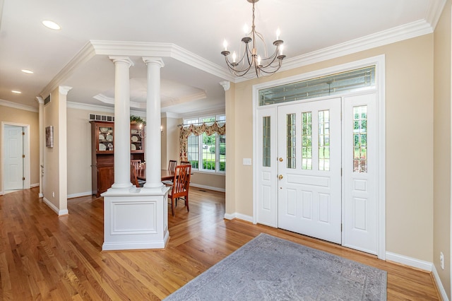 2316 Pinnacle Ct, Hebron, KY 41048 - foyer featuring a chandelier, ornamental molding, light wood-style flooring, decorative columns, and recessed lighting