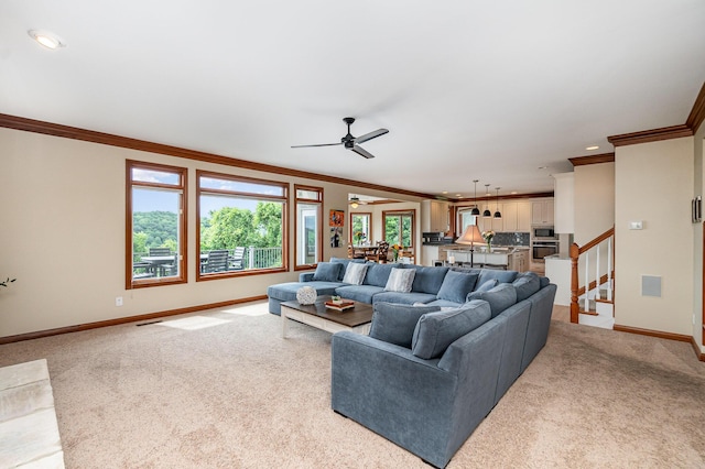 2316 Pinnacle Ct, Hebron, KY 41048 - living room with crown molding, light colored carpet, ceiling fan, recessed lighting, and stairs