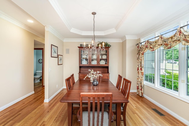2316 Pinnacle Ct, Hebron, KY 41048 - dining room with light wood-style floors, plenty of natural light, a chandelier, a tray ceiling, and ornamental molding
