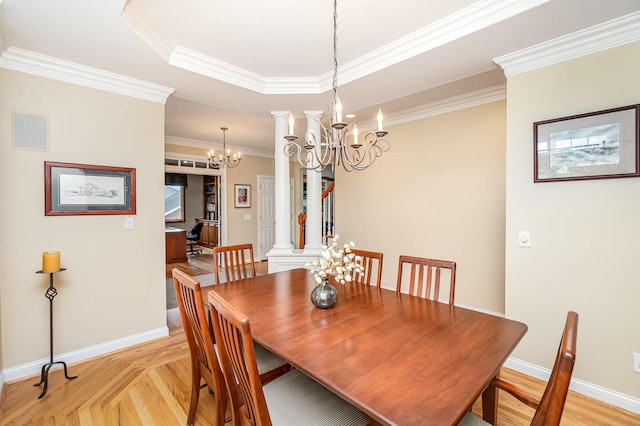 2316 Pinnacle Ct, Hebron, KY 41048 - dining space with a chandelier, ornate columns, ornamental molding, and a raised ceiling