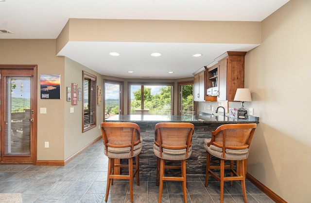 2316 Pinnacle Ct, Hebron, KY 41048 - indoor bar with baseboards and recessed lighting