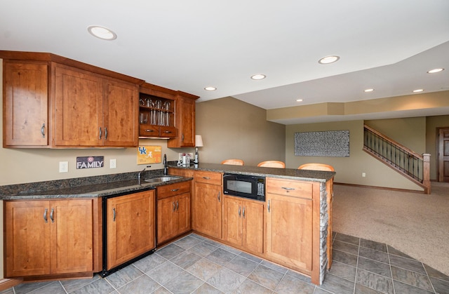 2316 Pinnacle Ct, Hebron, KY 41048 - kitchen featuring black microwave, a peninsula, open shelves, recessed lighting, and brown cabinetry