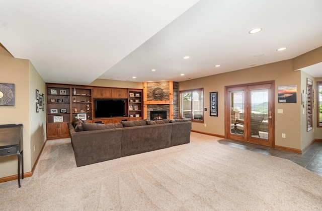 2316 Pinnacle Ct, Hebron, KY 41048 - living room with recessed lighting, light colored carpet, a stone fireplace, and built in shelves