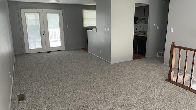 38 Carriage Hill Dr, Erlanger, KY 41018 - carpeted empty room with french doors and a sink