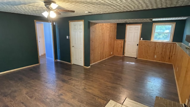 38 Carriage Hill Dr, Erlanger, KY 41018 - empty room with wood finished floors, a ceiling fan, a wainscoted wall, and wood walls