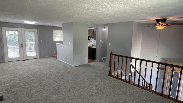 38 Carriage Hill Dr, Erlanger, KY 41018 - empty room with a textured ceiling, french doors, a ceiling fan, and carpet flooring