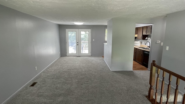 38 Carriage Hill Dr, Erlanger, KY 41018 - corridor with a textured ceiling, carpet floors, and french doors