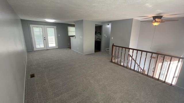 38 Carriage Hill Dr, Erlanger, KY 41018 - unfurnished room with carpet, a textured ceiling, a ceiling fan, and french doors
