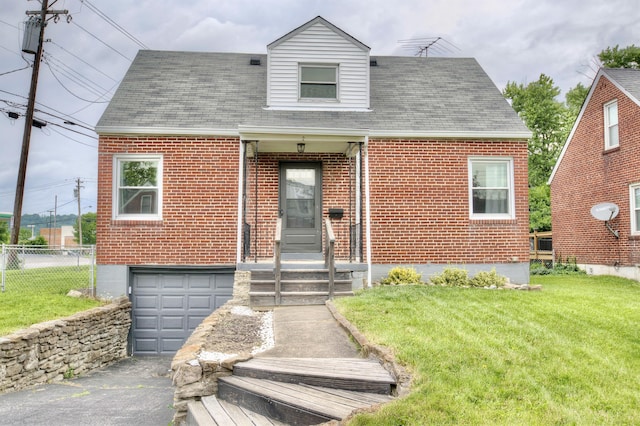 2 Doris Dr, Latonia, KY 41015 - cape cod house with brick siding, a garage, driveway, and roof with shingles